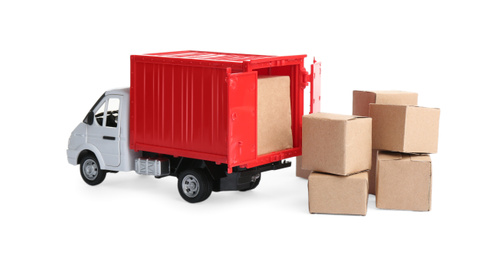 Photo of Truck model and carton boxes on white background. Courier service