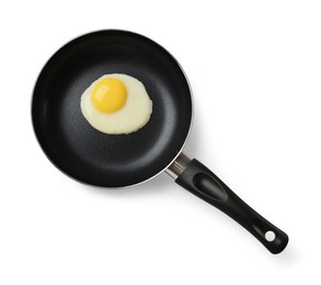 Delicious fried egg in frying pan isolated on white, top view