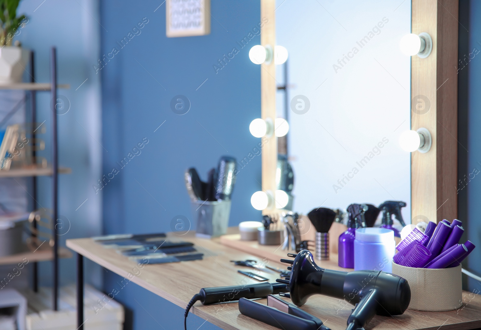 Photo of Hairdresser tools on table in salon