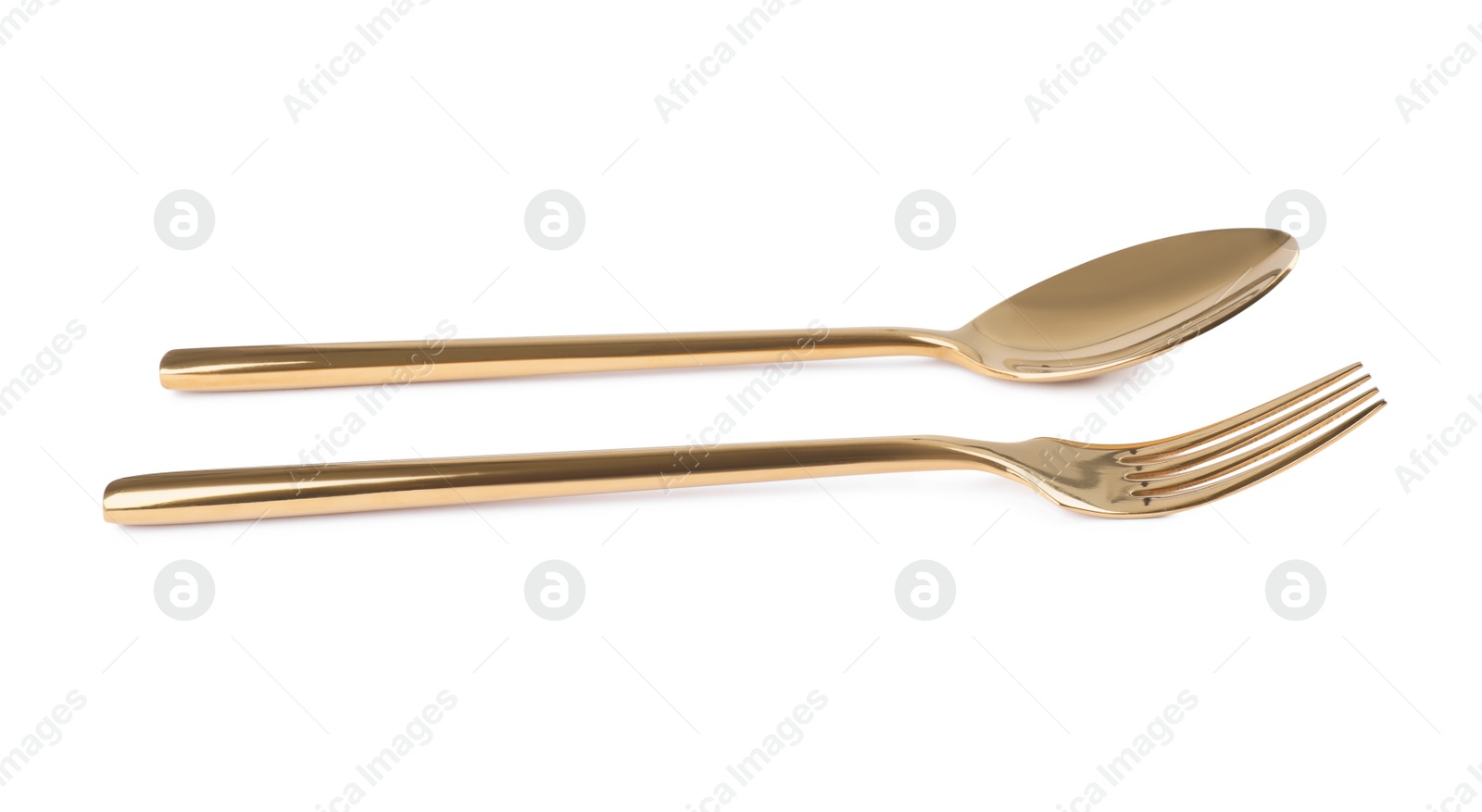 Photo of New shiny golden fork and spoon on white background