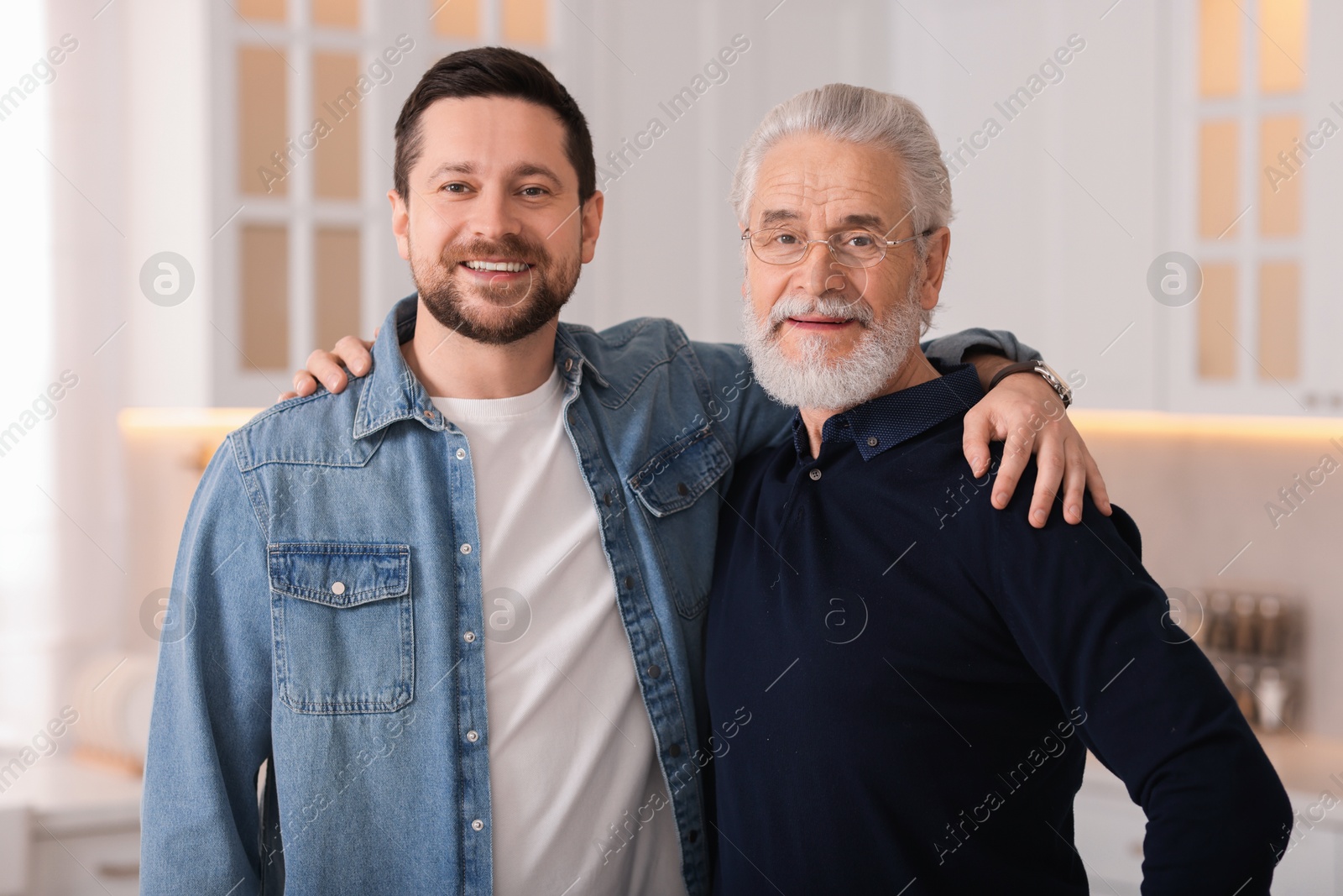 Photo of Happy son and his dad at home