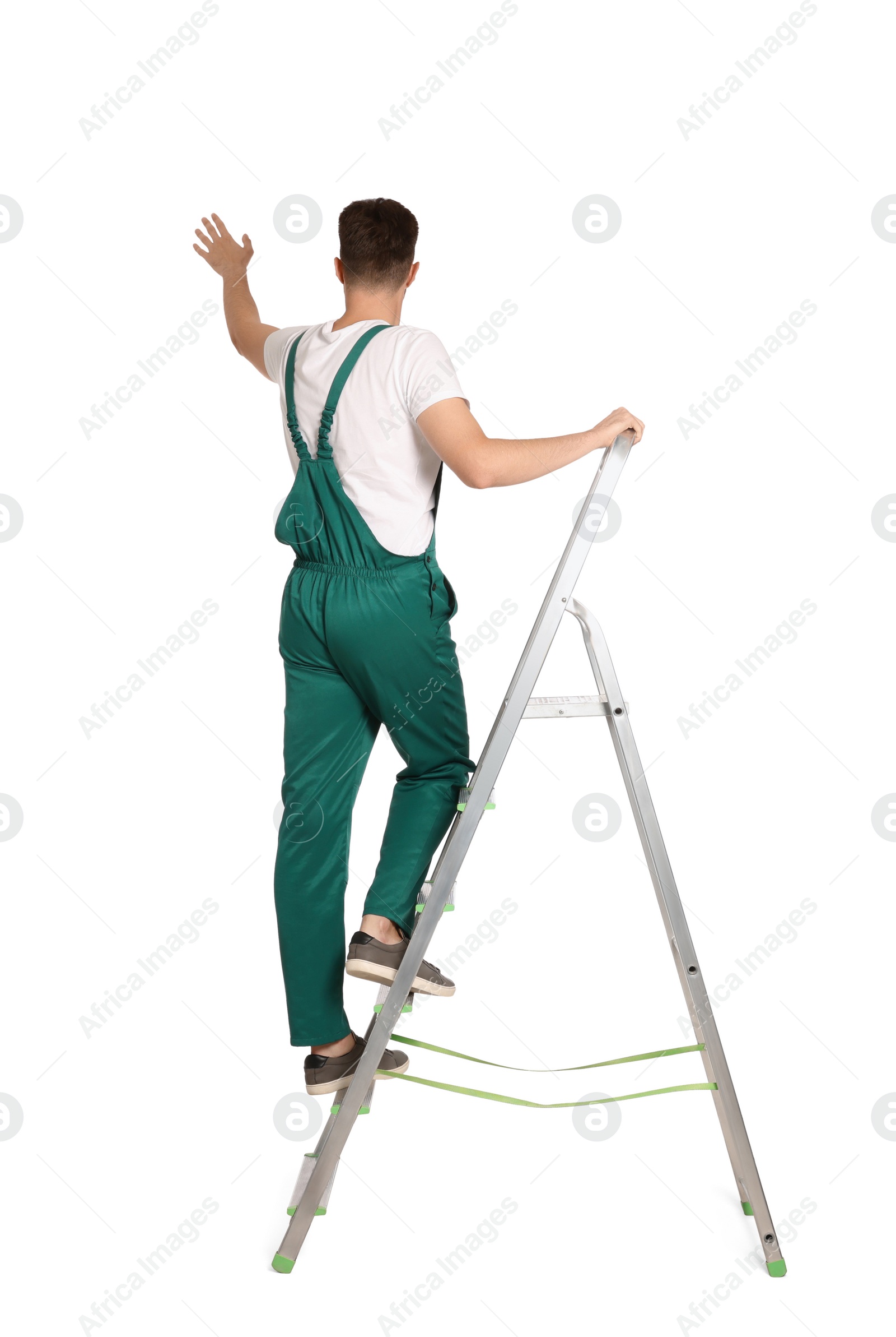 Photo of Worker in uniform climbing up metal ladder on white background