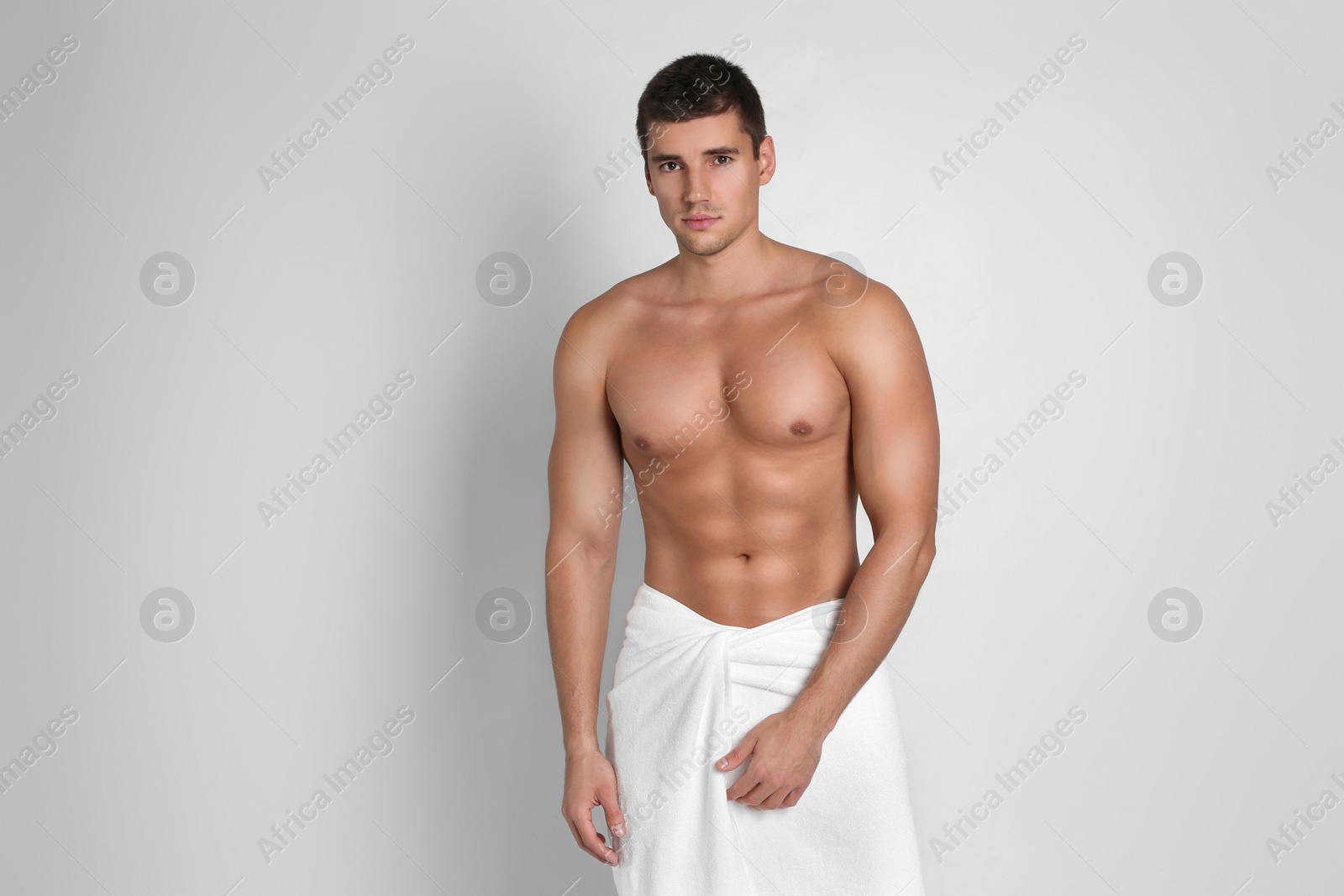 Photo of Man with sexy body on light background