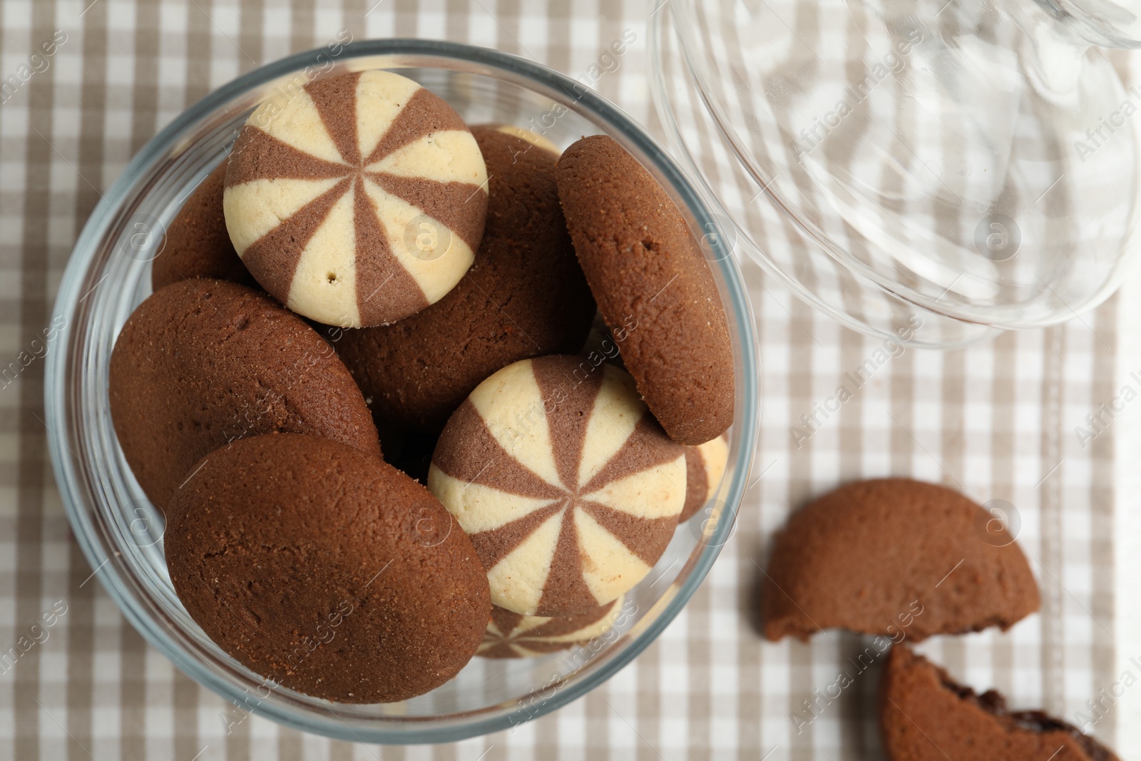 Photo of Delicious cookies in glass jar on table, top view