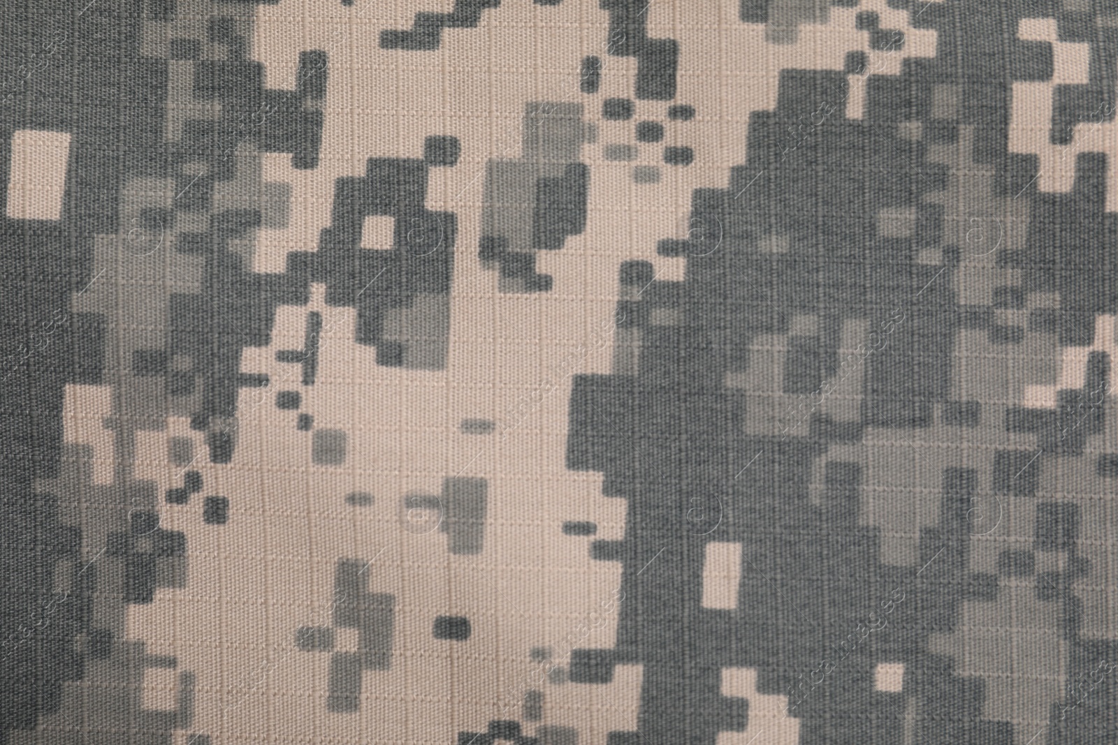 Photo of Texture of camouflage fabric as background, top view