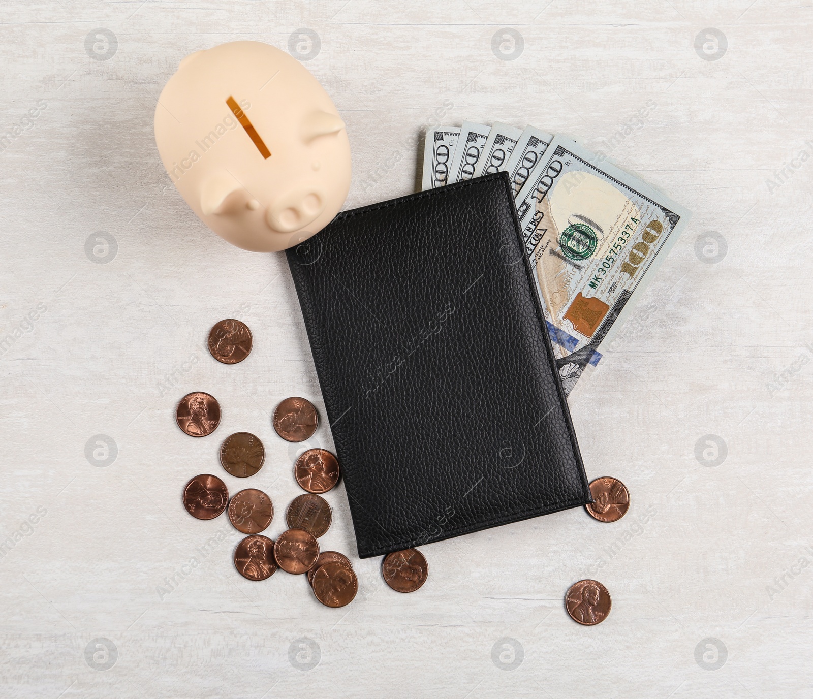 Photo of Pension certificate with American money and piggybank on grey stone table, flat lay