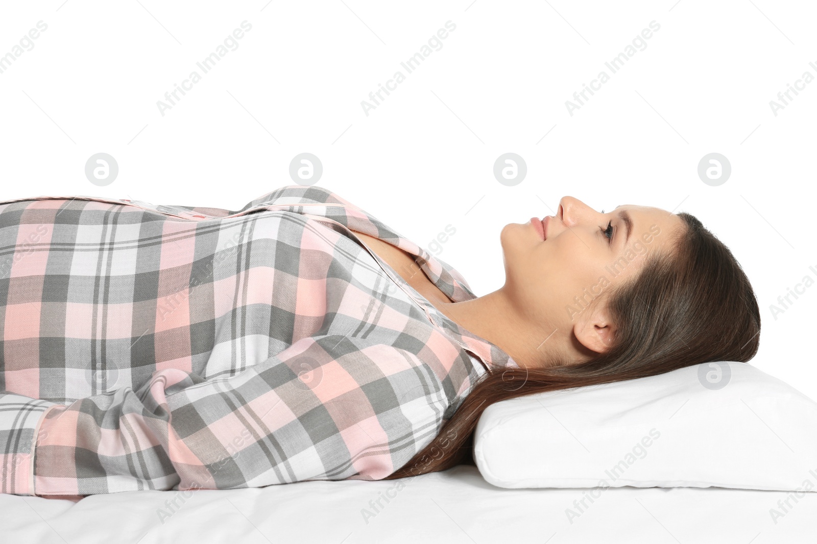 Photo of Beautiful pregnant woman lying with orthopedic pillow on bed against white background