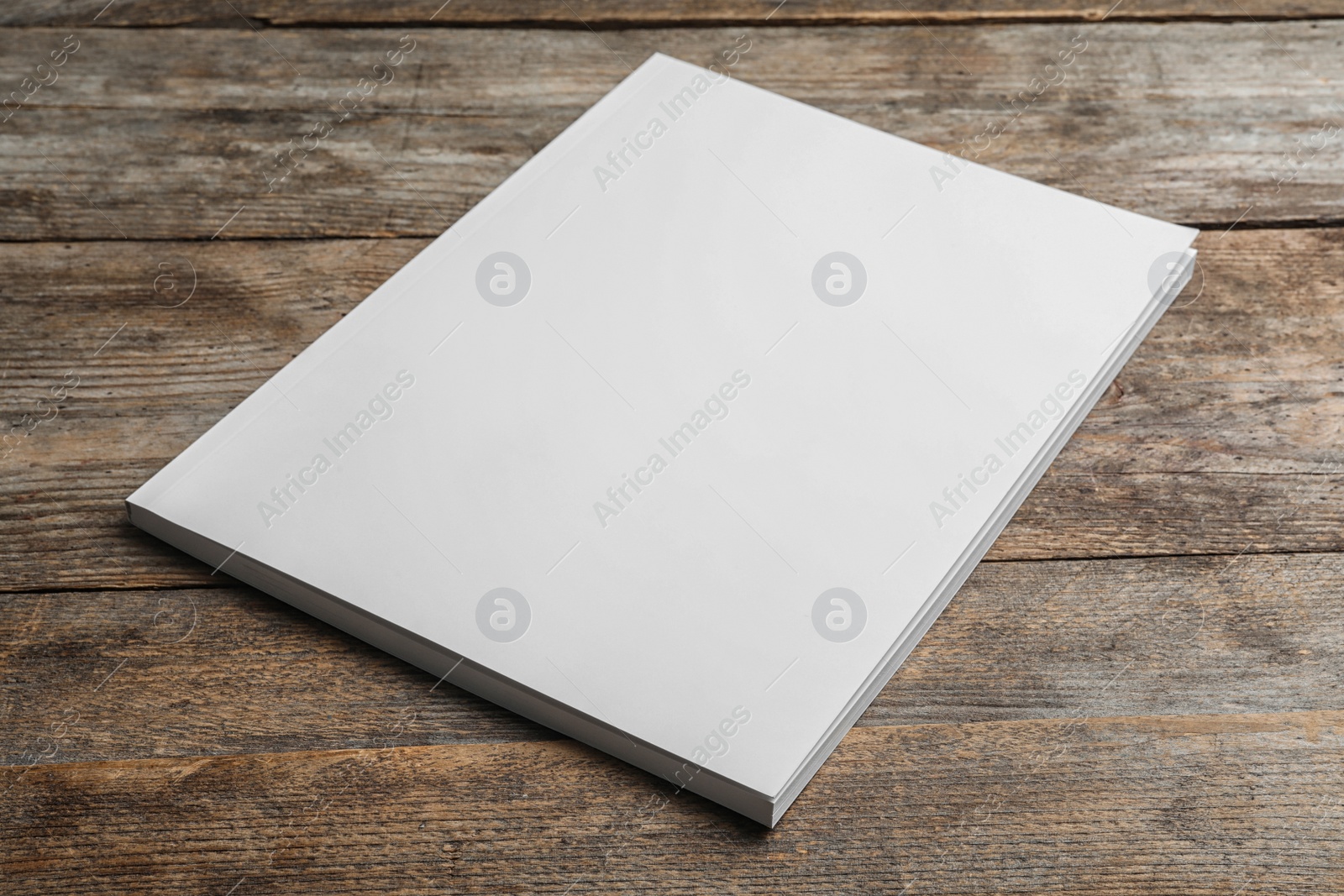 Photo of Brochure with blank cover on wooden background. Mock up for design