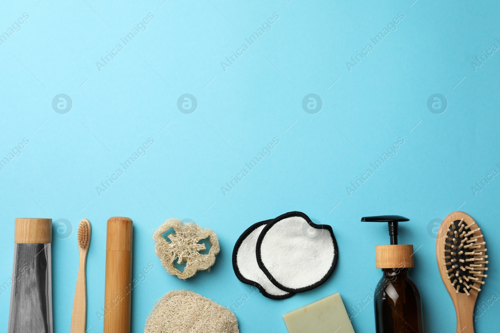 Photo of Flat lay composition with eco friendly products on light blue background, space for text. Conscious consumption