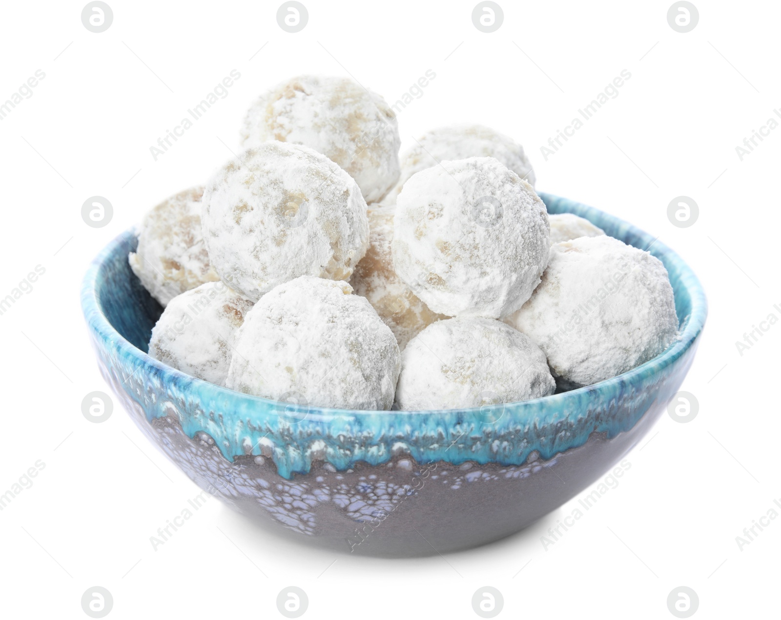 Photo of Tasty snowball cookies in bowl isolated on white. Christmas treat