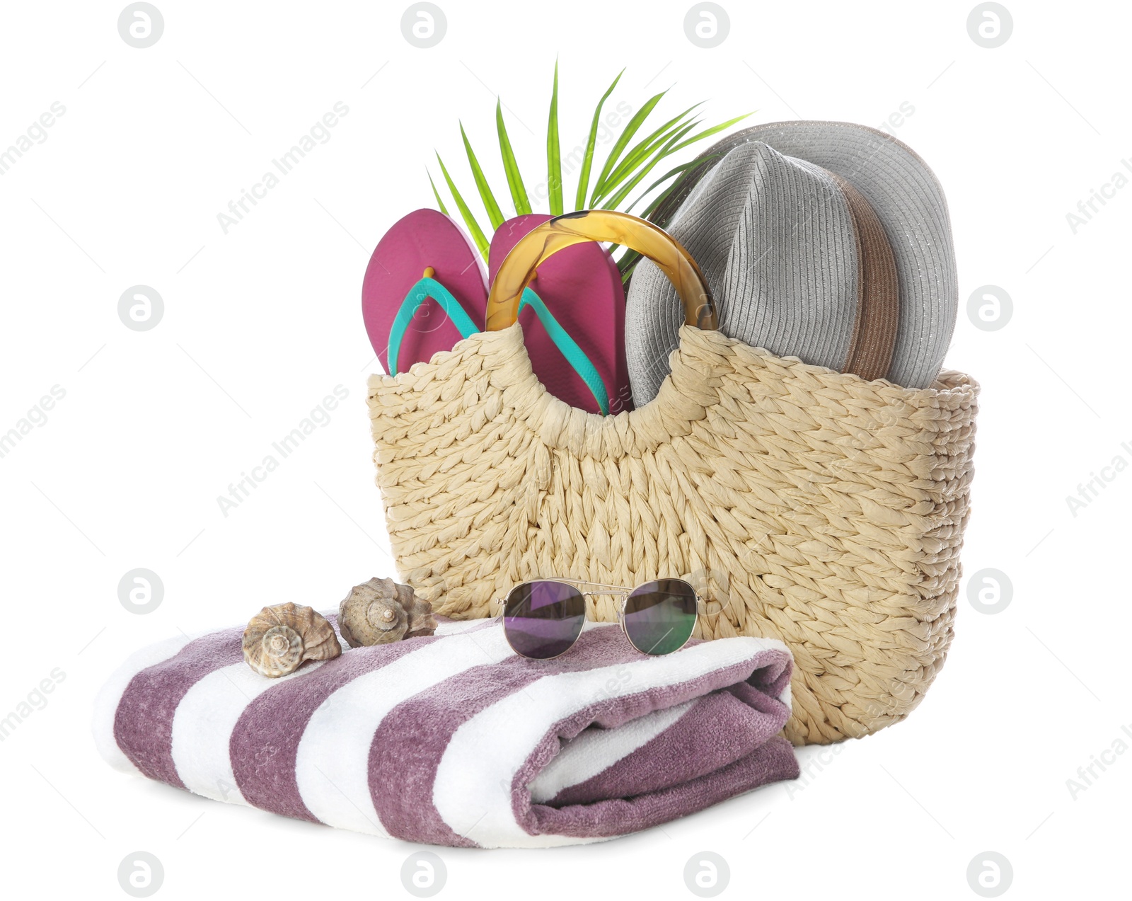 Photo of Bag with beach accessories on white background