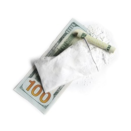 Photo of Cocaine in plastic bag and rolled money bill on white background, top view