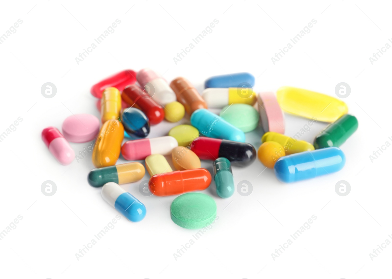 Photo of Many different pills isolated on white. Medicinal treatment