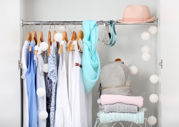 Photo of Women clothing on hangers in wardrobe