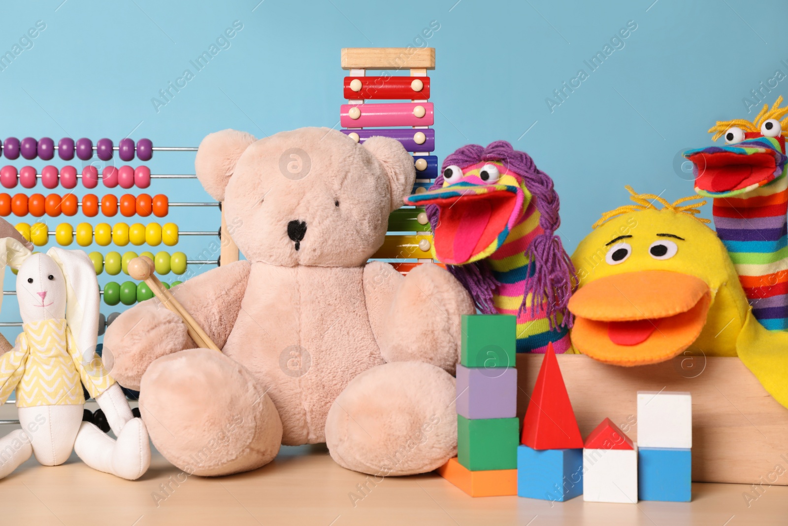 Photo of Collection of different toys on wooden table