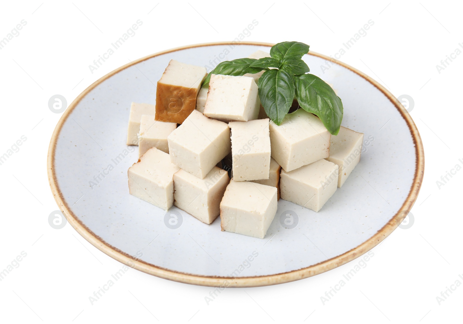 Photo of Plate with delicious fried tofu and basil on white background