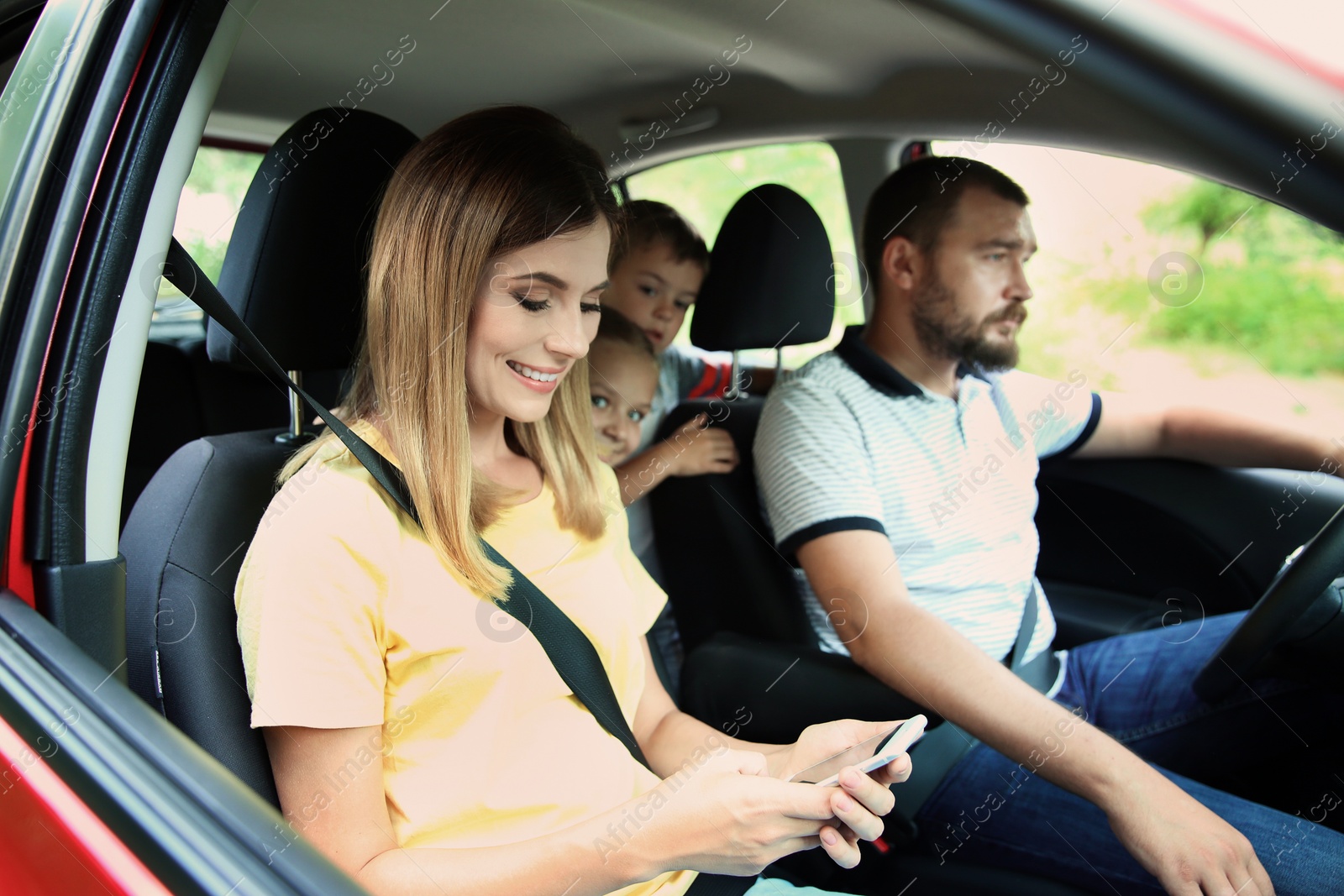 Photo of Happy family with children taking road trip together