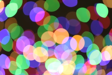 Photo of Beautiful colorful lights on dark background. Bokeh effect