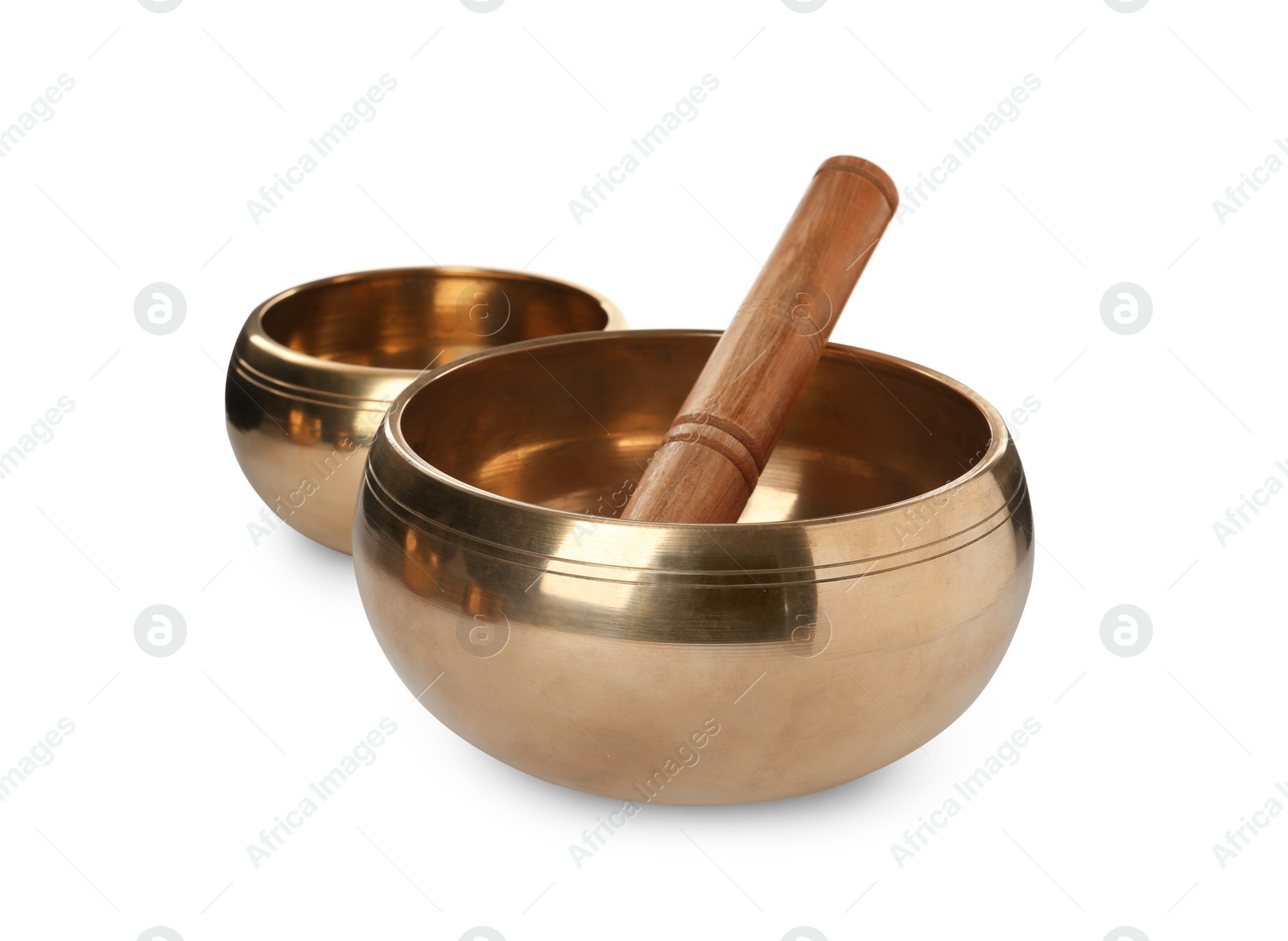 Photo of Tibetan singing bowls and wooden mallet on white background