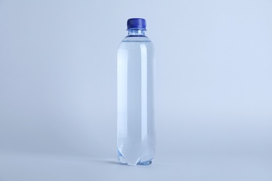 Plastic bottle with water on white background