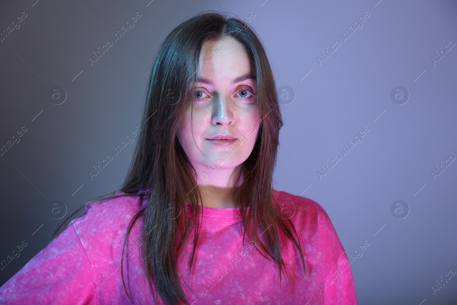 Photo of Portrait of beautiful woman on color background