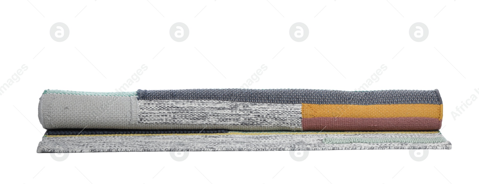 Photo of Rolled colorful carpet on white background. Interior element