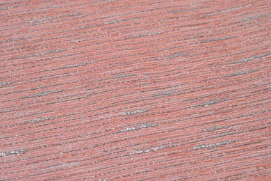 Red wallpaper sheet as background, closeup view