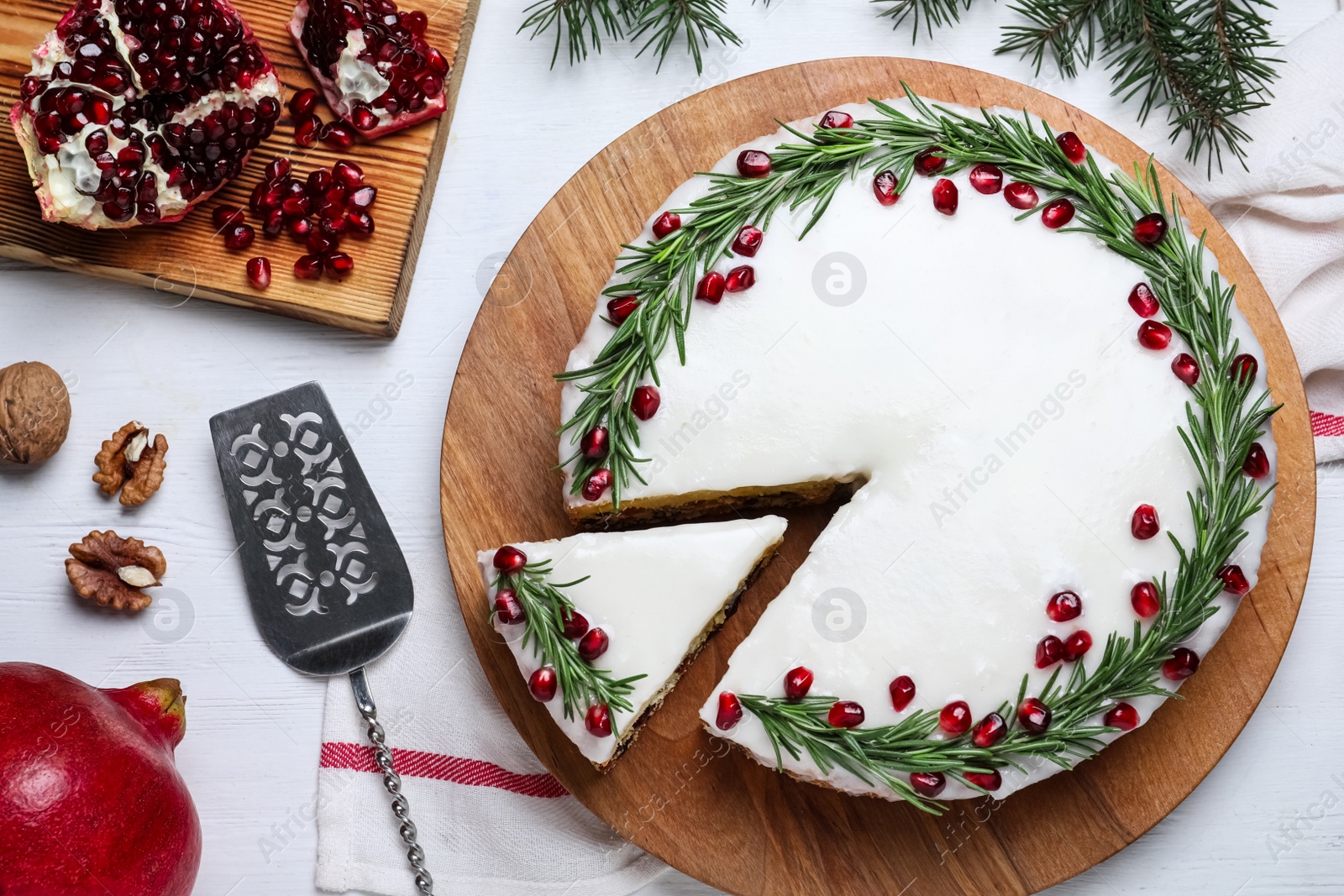 Photo of Flat lay composition with traditional Christmas cake on white wooden table