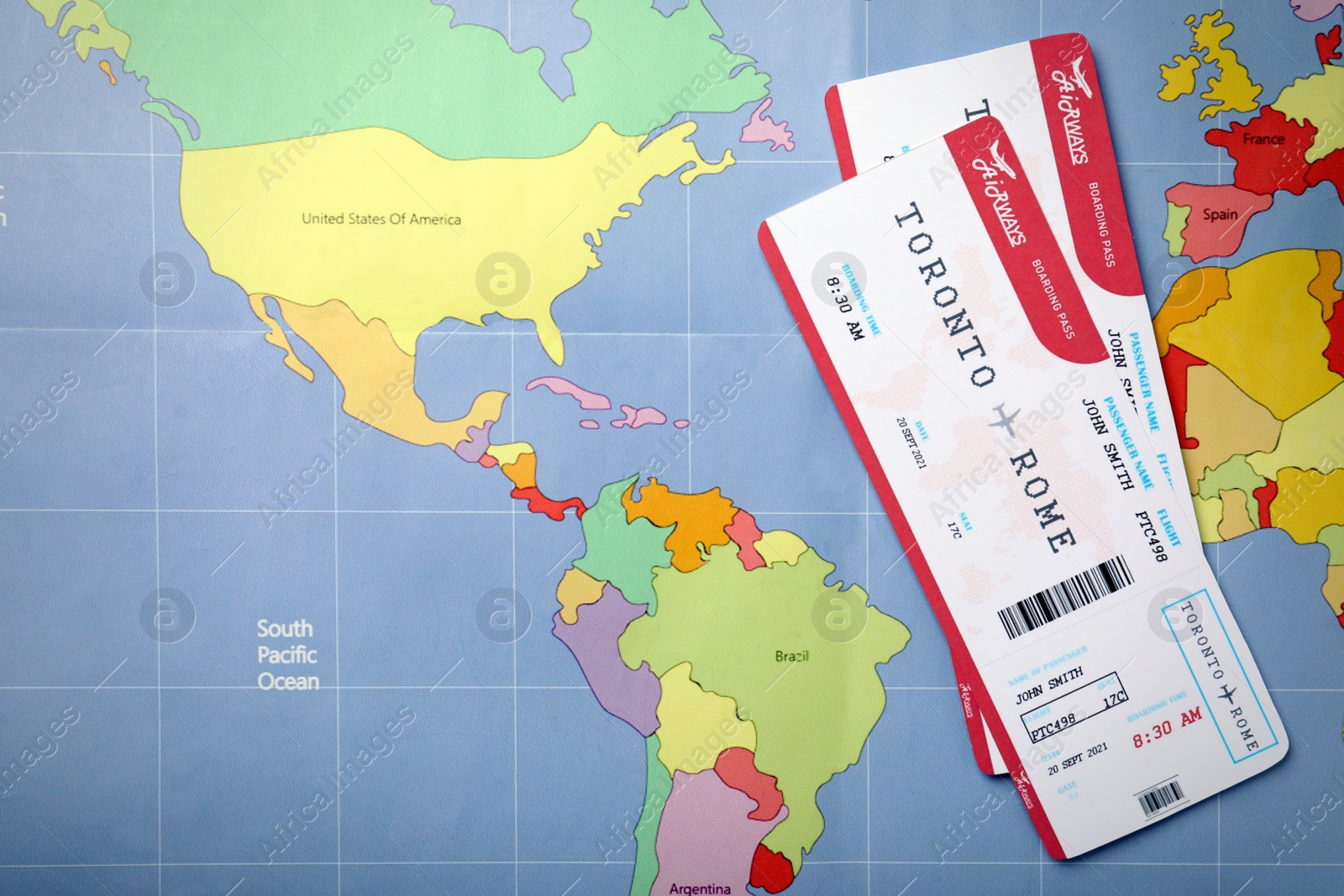 Photo of Tickets on world map, flat lay. Travel agency concept