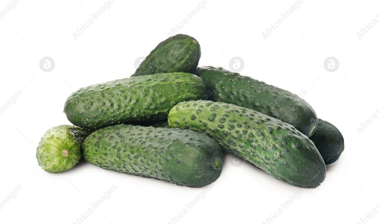 Photo of Heap of fresh ripe cucumbers on white background