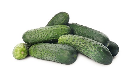 Photo of Heap of fresh ripe cucumbers on white background