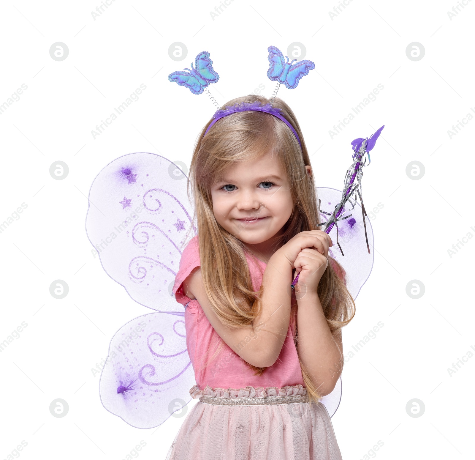 Photo of Cute little girl in fairy costume with violet wings and magic wand on white background