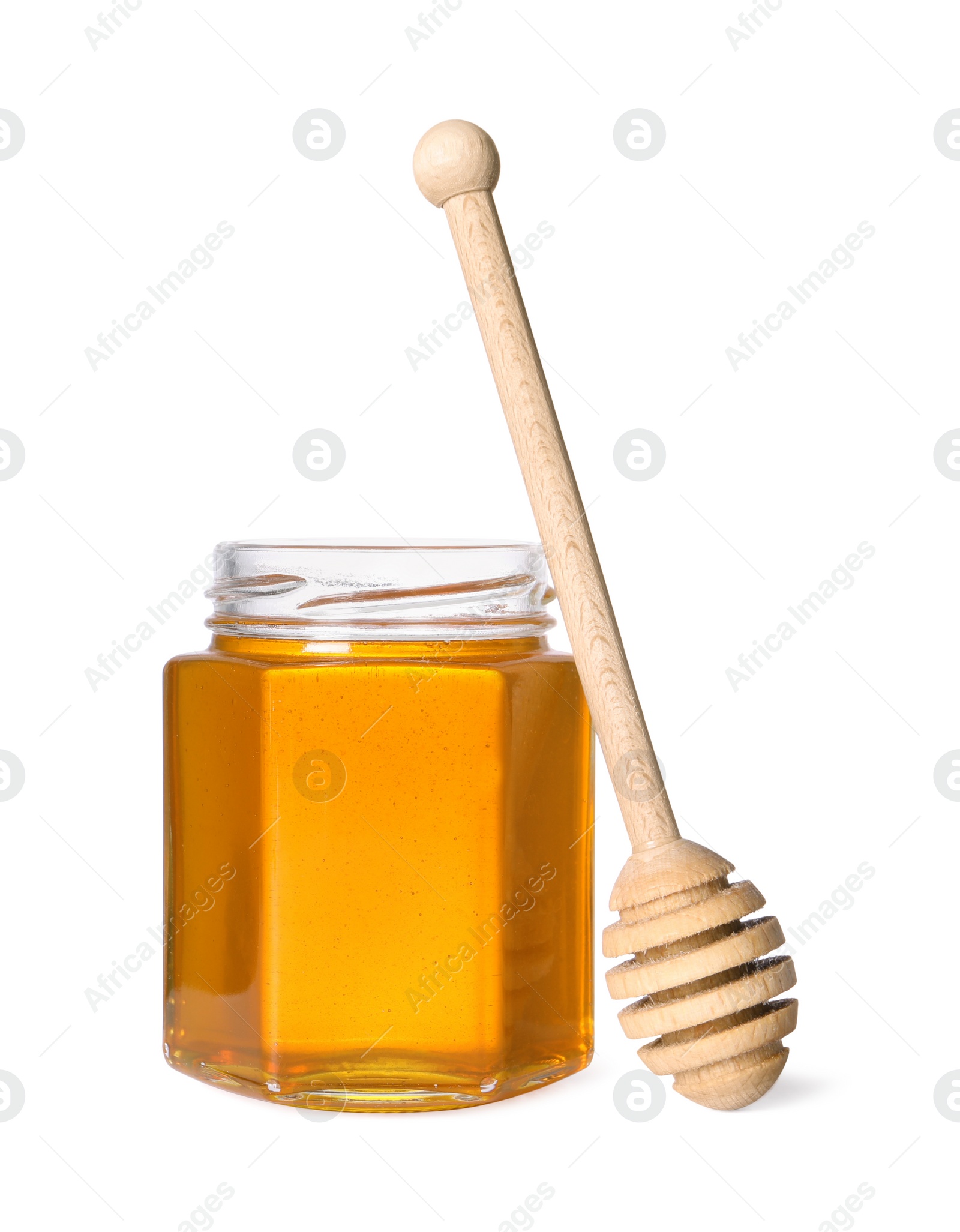 Photo of Tasty natural honey in glass jar and dipper isolated on white