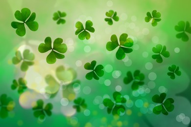 Image of St. Patrick's Day celebration. Clover leaves on green background, bokeh effect