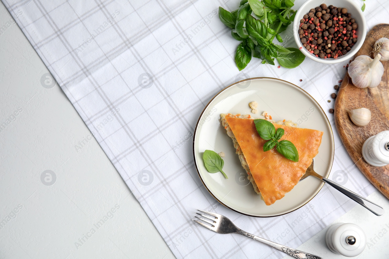 Photo of Delicious meat pie served on white table, flat lay. Space for text