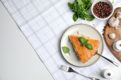 Delicious meat pie served on white table, flat lay. Space for text