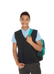 Portrait of African-American boy in school uniform with backpack on white background