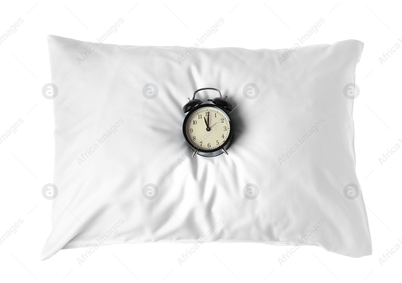 Photo of Blank soft pillow with alarm clock on white background