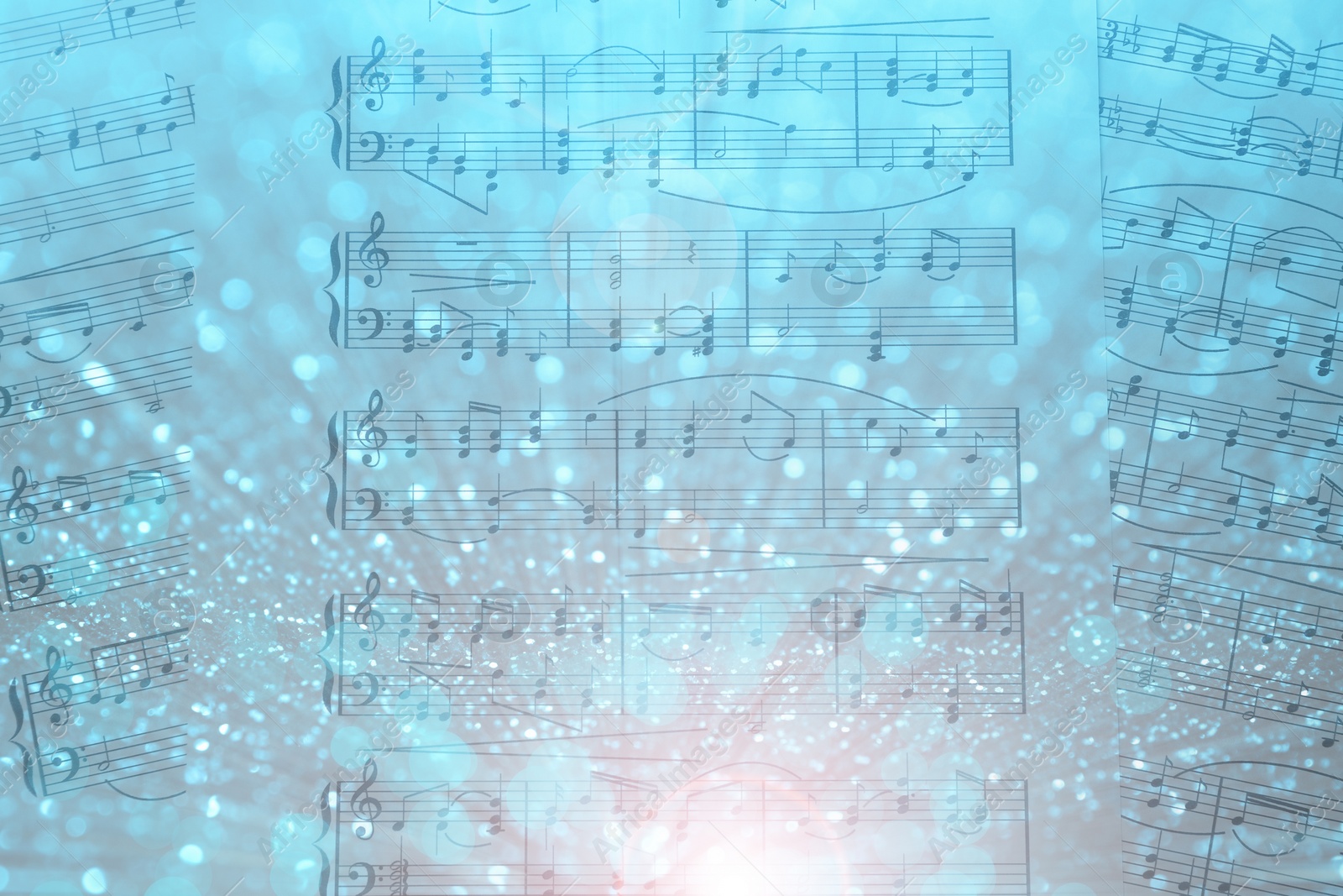 Image of Sheets with music notes as background, top view. Bokeh and color tone effects