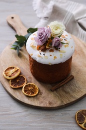 Photo of Traditional decorated Easter cake on wooden table