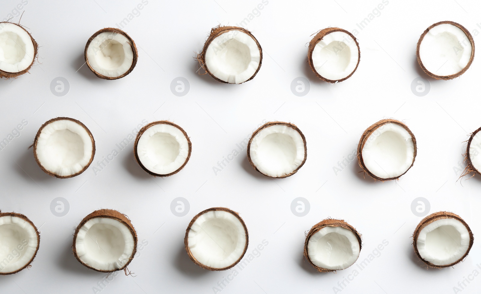 Photo of Coconut pattern on white background, top view