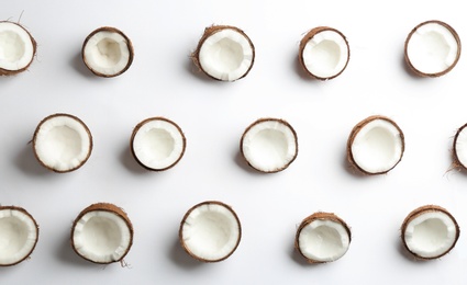 Photo of Coconut pattern on white background, top view