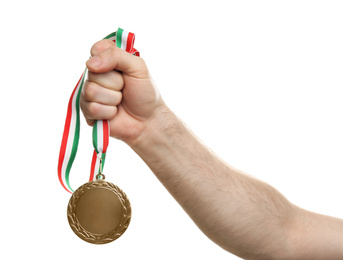 Photo of Man holding golden medal on white background, closeup. Space for design