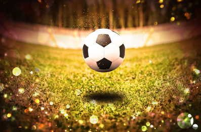 Image of Soccer ball on football field. Bokeh effect