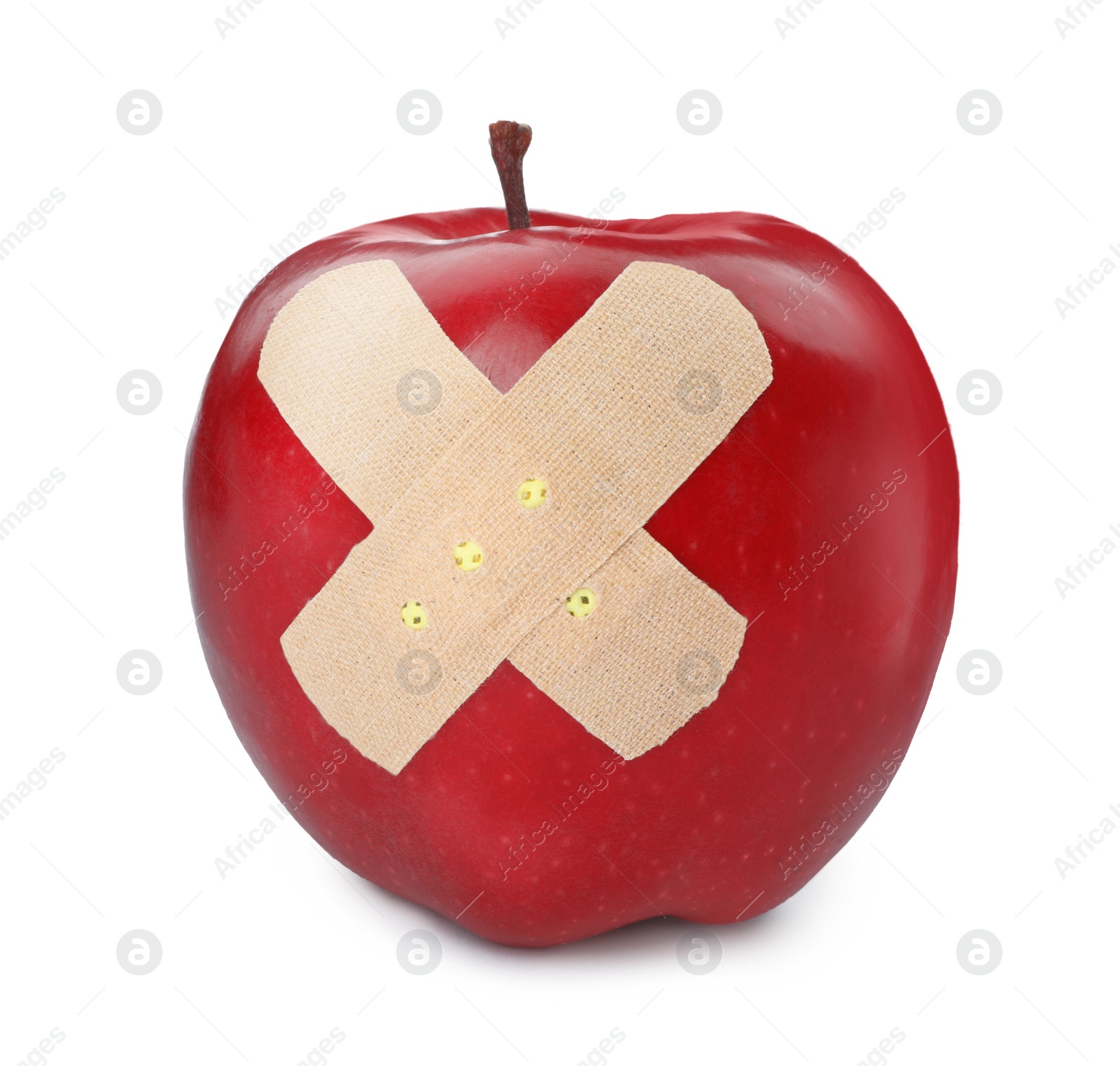 Photo of Red ripe apple with sticking plasters isolated on white