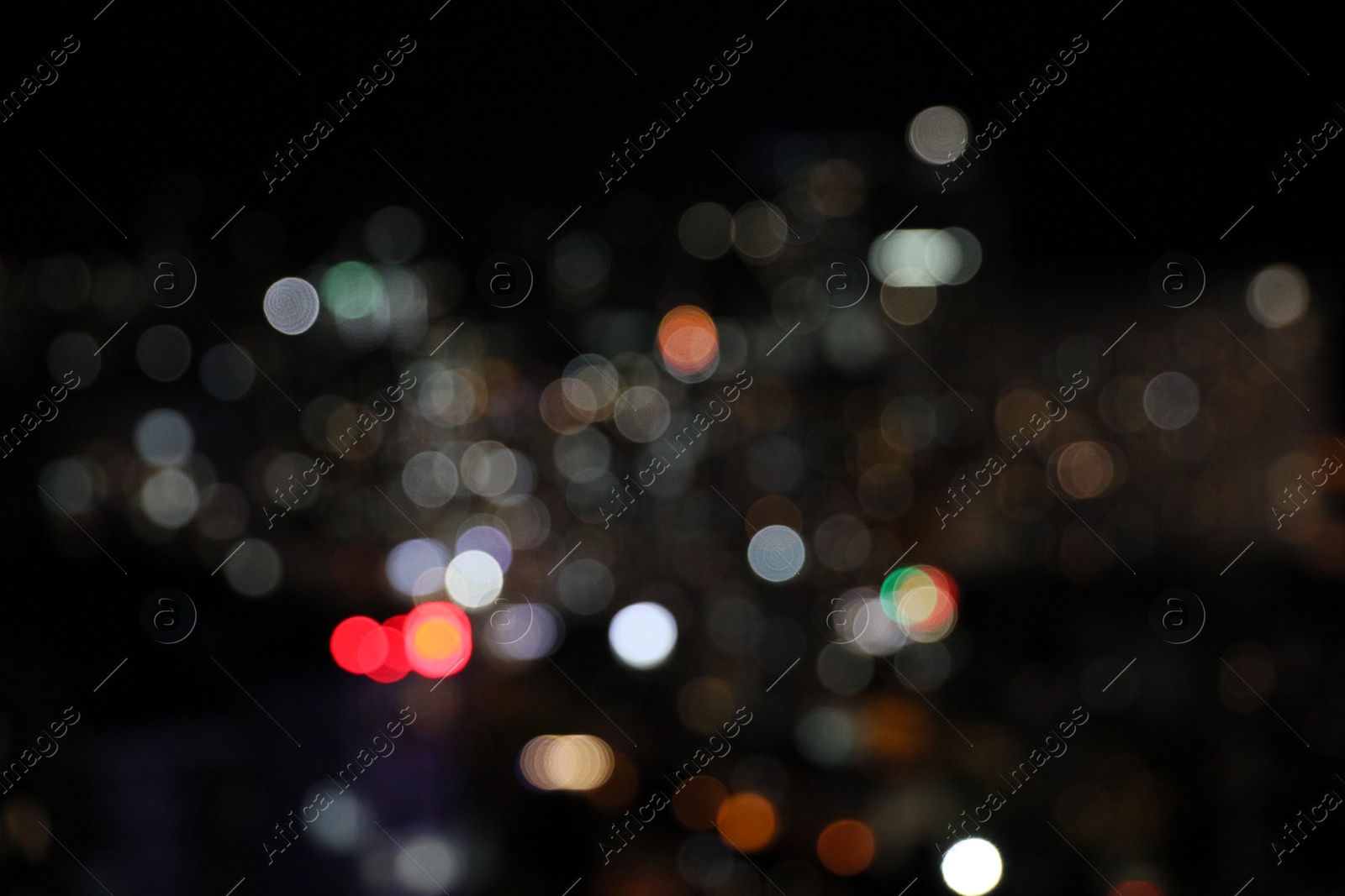 Photo of Blurred view of cityscape at night. Bokeh effect