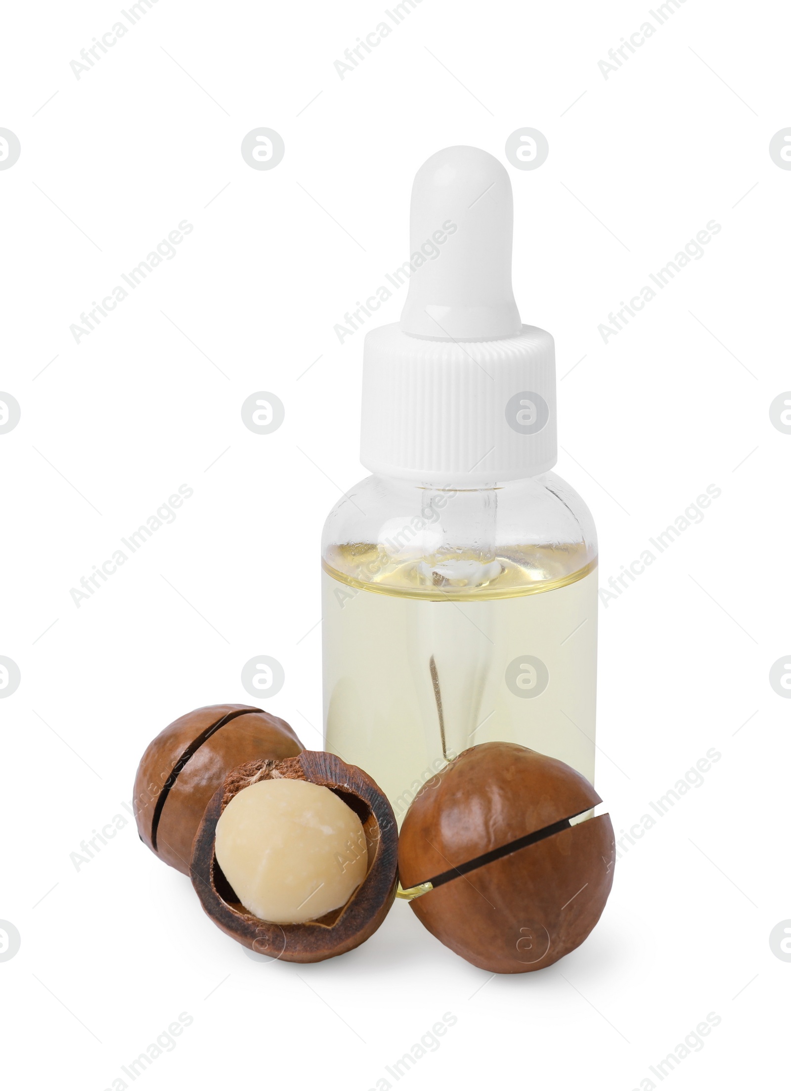 Photo of Delicious organic Macadamia nuts and natural oil isolated on white