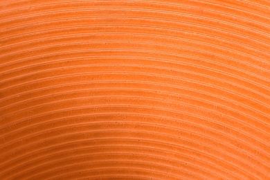 Texture of orange ceramic surface as background, closeup
