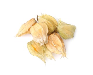 Photo of Many ripe physalis fruits with calyxes isolated on white, top view