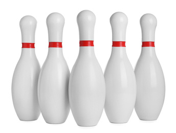 Photo of Bowling pins with red stripes isolated on white
